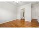 Bedroom with hardwood floors adjacent to ensuite bathroom and closet at 2300 Peachford Rd # 3411, Atlanta, GA 30338
