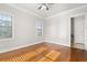 Bedroom with hardwood floors adjacent to ensuite bathroom at 2300 Peachford Rd # 3411, Atlanta, GA 30338