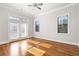 Sun-filled bedroom features hardwood floors and double doors at 2300 Peachford Rd # 3411, Atlanta, GA 30338