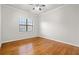 Bedroom with hardwood floors and a large window at 2300 Peachford Rd # 3411, Atlanta, GA 30338