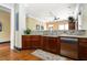 A kitchenette featuring granite countertops, modern appliances, and dark wood cabinets at 2300 Peachford Rd # 3411, Atlanta, GA 30338