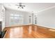 Spacious living area with hardwood floors, built-ins, and access to a patio offering great indoor-outdoor living at 2300 Peachford Rd # 3411, Atlanta, GA 30338