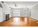 Open living space boasts hardwood floors, a cozy fireplace, built-ins, and lots of natural light at 2300 Peachford Rd # 3411, Atlanta, GA 30338