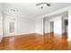 Open-concept living room with hardwood floors, natural light, and seamless flow into other areas of the home at 2300 Peachford Rd # 3411, Atlanta, GA 30338