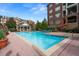 Community pool with lounge chairs and well-maintained landscaping at 2300 Peachford Rd # 3411, Atlanta, GA 30338