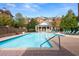 Community pool with lounge chairs and well-maintained landscaping at 2300 Peachford Rd # 3411, Atlanta, GA 30338