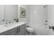 Bathroom featuring a tub and shower combination with gray cabinets and white subway tile at 2320 Elgar Park Pl # 95, Duluth, GA 30096