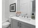 A bathroom with gray cabinetry, a white countertop, and modern fixtures at 2320 Edgar Park Pl # 95, Duluth, GA 30096