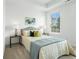 Comfortable bedroom featuring a plush bed, stylish side tables, and a sunlit window at 2320 Edgar Park Pl # 95, Duluth, GA 30096