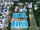 Panoramic aerial view highlighting community with tennis courts, pool, basketball court surrounded by residential homes at 283 Harmony Lake Dr, Canton, GA 30115