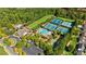 An aerial view shows the community pool, tennis courts, playground, clubhouse, and parking lot at 283 Harmony Lake Dr, Canton, GA 30115