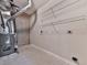 Unfinished basement area featuring laundry hookups, shelving, and utility connections at 283 Harmony Lake Dr, Canton, GA 30115