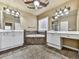 A bathroom featuring dual vanities, a ceiling fan, and a standalone tub at 283 Harmony Lake Dr, Canton, GA 30115