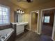 Spacious bathroom with vanity, soaking tub, and walk in closet at 283 Harmony Lake Dr, Canton, GA 30115