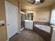 Relaxing bathroom featuring a soaking tub, separate shower, and vanity with ample storage at 283 Harmony Lake Dr, Canton, GA 30115