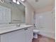 Bathroom featuring a shower-over-tub combo, toilet, and single vanity sink at 283 Harmony Lake Dr, Canton, GA 30115