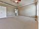 Bedroom featuring neutral carpeting and an ensuite bath at 283 Harmony Lake Dr, Canton, GA 30115