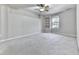 Bedroom with neutral walls, plush carpet, built in shelving and a window at 283 Harmony Lake Dr, Canton, GA 30115