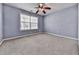 Serene blue bedroom with natural light, providing a calming and comfortable space at 283 Harmony Lake Dr, Canton, GA 30115