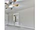 Bright bedroom featuring a ceiling fan, neutral paint, and access to an en-suite bathroom at 283 Harmony Lake Dr, Canton, GA 30115