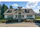 Exterior of community clubhouse with stone accents, well-maintained landscaping, and inviting entrance at 283 Harmony Lake Dr, Canton, GA 30115