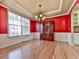 Elegant dining room features hardwood floors, crown molding, and a classic chandelier at 283 Harmony Lake Dr, Canton, GA 30115