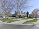 Suburban home with manicured lawn, mature trees and a circular driveway at 283 Harmony Lake Dr, Canton, GA 30115