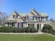 Charming brick two-story home with well-maintained landscaping, classic shutters, and a welcoming front porch at 283 Harmony Lake Dr, Canton, GA 30115