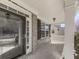 Charming front porch featuring brick columns, black shutters, and a glass front door at 283 Harmony Lake Dr, Canton, GA 30115