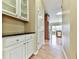 Hallway view of cabinetry and stainless steel refrigerator in the distance at 283 Harmony Lake Dr, Canton, GA 30115