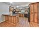 Well-lit kitchen with wood cabinets, breakfast bar, and black appliances at 283 Harmony Lake Dr, Canton, GA 30115
