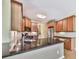 Spacious kitchen featuring wood cabinets, stainless appliances, and a dark granite countertop at 283 Harmony Lake Dr, Canton, GA 30115