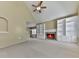 Large living room featuring a brick fireplace, built-in shelving and access to the kitchen at 283 Harmony Lake Dr, Canton, GA 30115