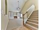 Inviting living room with a cozy fireplace, built-in shelving, and a staircase leading to the upper level at 283 Harmony Lake Dr, Canton, GA 30115