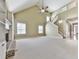 Bright living room with vaulted ceiling, stairway to the second floor, and views of the entry at 283 Harmony Lake Dr, Canton, GA 30115