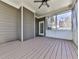 Covered back porch featuring gray painted floors and walls, and access to backyard at 283 Harmony Lake Dr, Canton, GA 30115