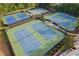 Aerial view of the neighborhood tennis courts offering multiple well-maintained courts and spectator seating at 283 Harmony Lake Dr, Canton, GA 30115