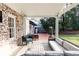 Back porch with a brick wall and a white roof at 2911 N Hills Ne Dr, Atlanta, GA 30305