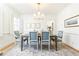 Formal dining room with hardwood floors, elegant chandelier, and neutral decor at 2911 N Hills Ne Dr, Atlanta, GA 30305