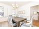 Bright dining room with hardwood floors, chandelier, neutral walls, and a table set for six at 2911 N Hills Ne Dr, Atlanta, GA 30305