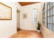 Bright hallway with tile floors, brick walls, and lots of natural light at 2911 N Hills Ne Dr, Atlanta, GA 30305