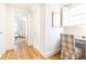 Hallway with hardwood floors and a desk with a plaid chair next to a window with white shutters at 2911 N Hills Ne Dr, Atlanta, GA 30305