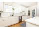 Bright kitchen featuring white cabinets, subway tile backsplash, and stainless steel appliances at 2911 N Hills Ne Dr, Atlanta, GA 30305