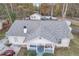 An aerial shot reveals a charming home with a spacious backyard, shed, and inviting front porch at 3109 Meadow Wood Ct, Lawrenceville, GA 30044