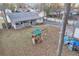 Backyard featuring a covered porch and a large grassy area with a playground at 3109 Meadow Wood Ct, Lawrenceville, GA 30044