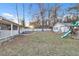 Spacious backyard with storage building, white fence, playground and mature trees at 3109 Meadow Wood Ct, Lawrenceville, GA 30044