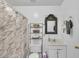 Bathroom featuring a shower with curtain, toilet, vanity, and decorative wicker mirror and shelves at 3109 Meadow Wood Ct, Lawrenceville, GA 30044