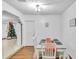 Cozy dining room with a white table, seating for four and hardwood floors at 3109 Meadow Wood Ct, Lawrenceville, GA 30044