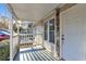 Sunlit porch view with stone accents and a white door, perfect for a cozy welcome at 3109 Meadow Wood Ct, Lawrenceville, GA 30044