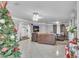 Spacious living room with tile floors, an open layout, and a charming Christmas tree at 3109 Meadow Wood Ct, Lawrenceville, GA 30044